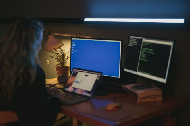 A woman working on a laptop